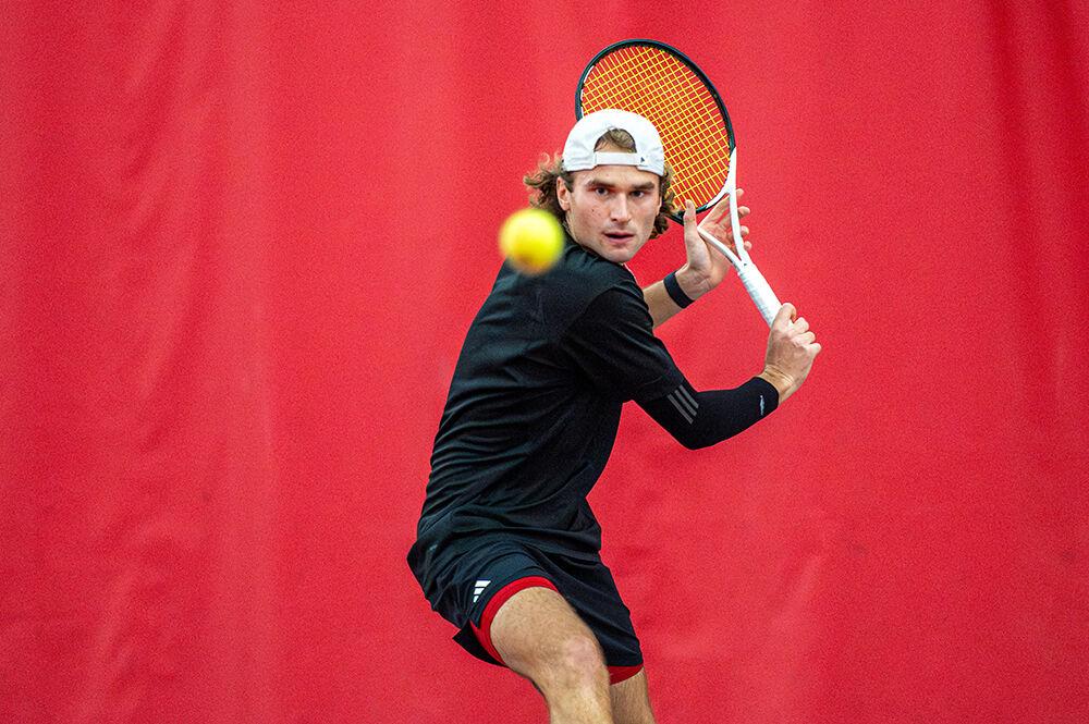Sophomore Martin Borisiouk locks eyes on the ball during the match against Northwestern at J.W. Isenhour Tennis Center on Monday, Jan. 15, 2024. Borisiouk won his singles match 6-4, 6-1. NC State won 6-1 against Northwestern.