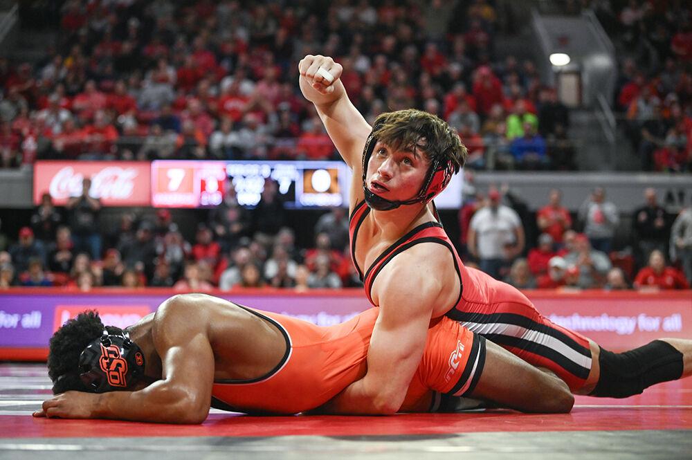 Sophomore Jackson Arrington takes a controlling position to win his bout during the duel against the Oklahoma State Cowboys in Reynolds Coliseum on Friday, Jan. 5, 2024. Arrington won his bout by 10-0 shutout. The Cowboys defeated the Wolfpack 22-12.