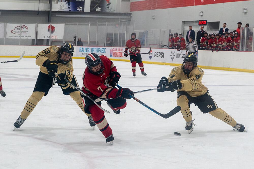 Junior forward Zach Robinson shoots the puck on net during the Icepack's home hockey game agianst the Wake Forest Demon Deacons in Invisalign Arena on Friday, Jan. 19, 2024. The Icepack defeated the Deacons 7-2.