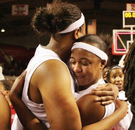 In this archive photo taken on Feb. 16, 2007, after defeating North Carolina 72-65, senior center Gillian Goring shares an embrace with senior guard Ashley Key. The players were surrounded by students who rushed the newly named Kay Yow Court.