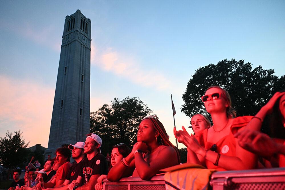 Students line up across the stage barricade as the pep rally begins at Packapalooza at Hillsborough Street on Saturday, Aug. 26, 2023. Packapalooza is a street festival that celebrates the beginning of the new school year. The pep rally showcased student athletes across multiple teams at NC State.