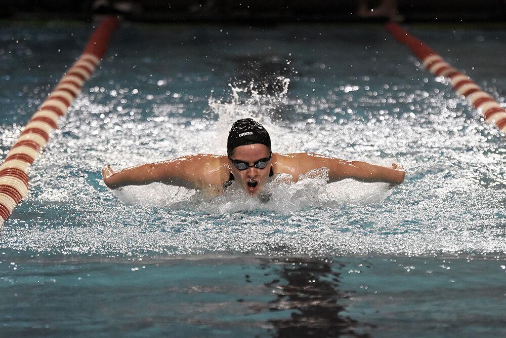 Sophomore Caroline Sheble comes up for air in the women's 200-yard butterfly during the NC State Wolfpack's swimming and diving meet against the UNC-Wilmington Seahawks at the Willis R. Casey Aquatic Center on Friday, Jan. 27, 2023. Sheble placed first in the heat with a 1:58.64. The Wolfpack women beat the Seahawks 186-105.
