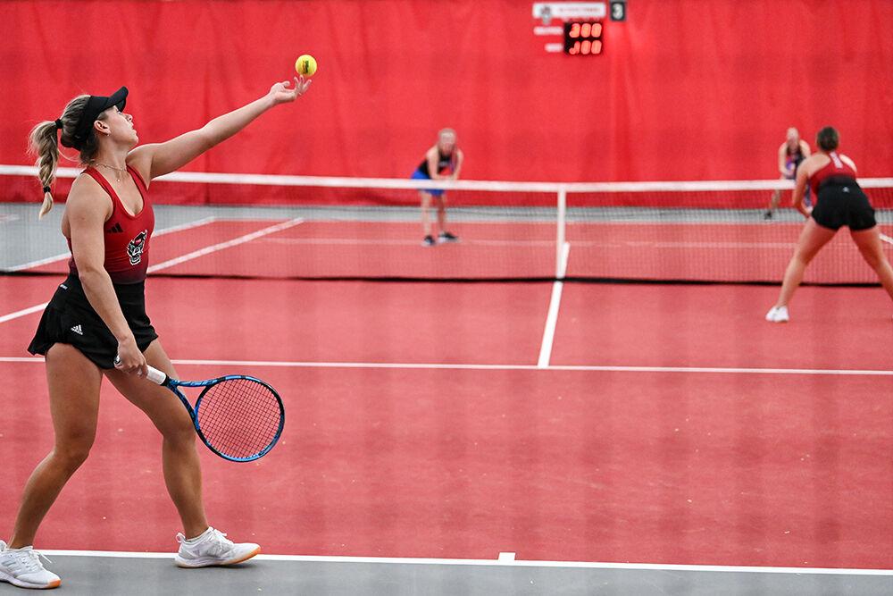 Freshman Gabriella Broadfoot serves the ball during the match against SMU at J.W. Isenhour Tennis Center on Monday, Jan. 15, 2024. Broadfoot and Rencheli won the doubles match 6-1. NC State defeated SMU 7-0.