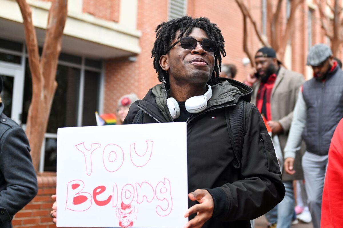 Henoc Dossou, a fourth-year studying computer science, walks with friends during the March Like Martin event from Stafford Commons to Harris Field on Friday, Jan. 19, 2024. The student-led march honored Martin Luther King Jr.&#8217;s legacy and promoted activism.