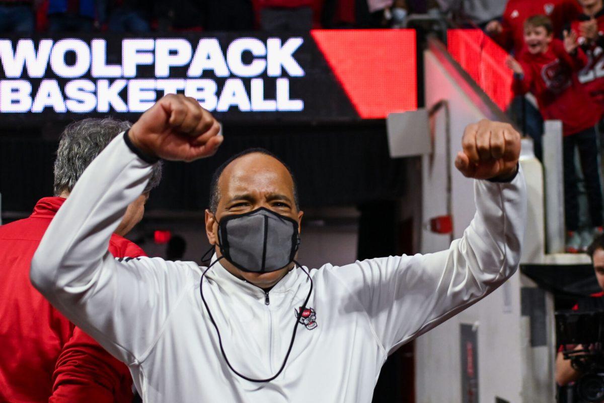 Head coach Kevin Keatts celebrates the Wolfpack win over the Wake Forest Demon Deacons in PNC Arena on Tuesday, Jan. 16, 2024. Keatts was ejected from the game with three minutes left in the first half after disagreeing with a foul call. The Wolfpack beat the Demon Deacons 83-76.