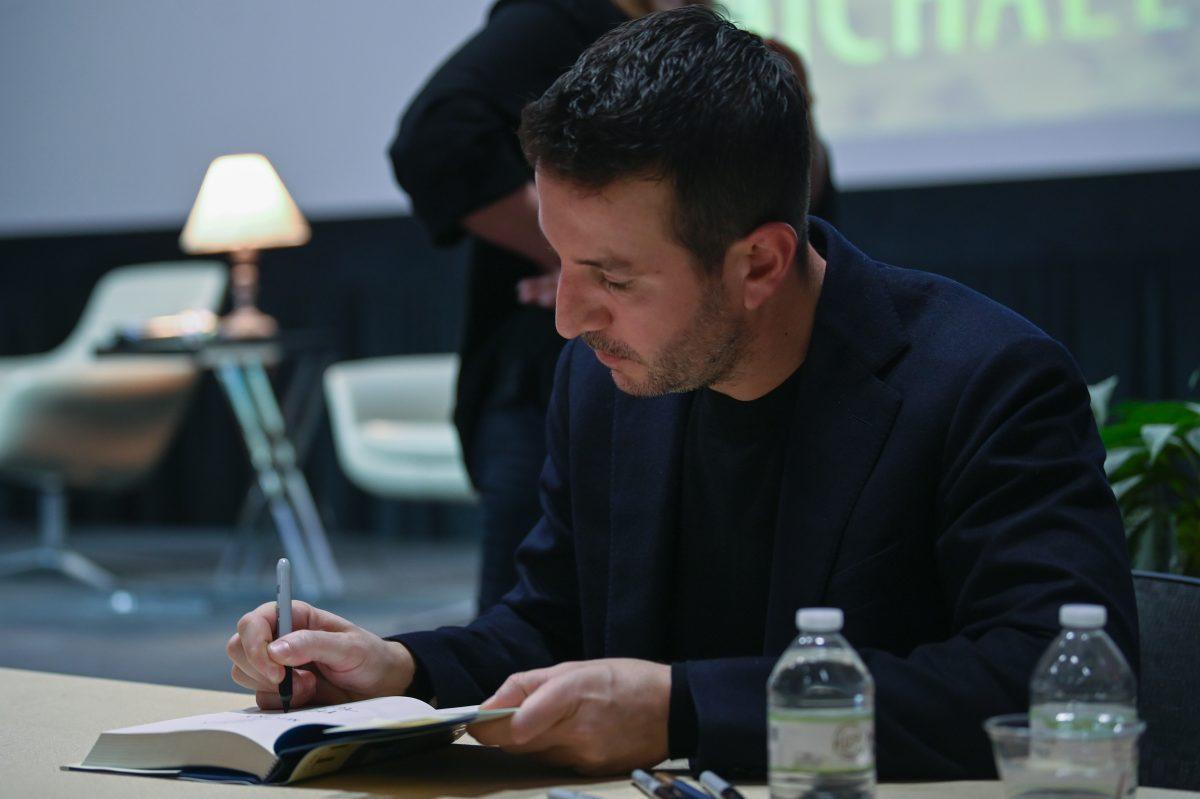 Alex Michaelides, #1 New York Times bestselling author of "The Silent Patient," signs his book for a reader during the Author Event in Witherspoon Student Center on Wednesday, Jan. 24, 2024. Michaelides responded to audience member's questions about his new book "The Fury," which was available for purchase at the event.