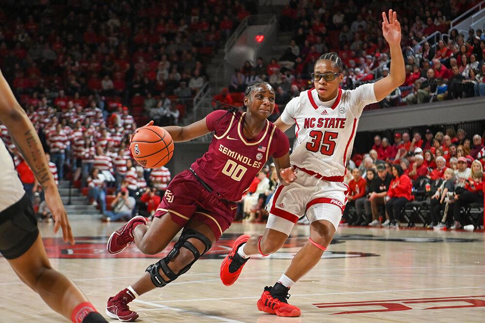 Freshman guard Zoe Brooks follows an opponent down the court in the game against Florida State inside Reynolds Coliseum on Thursday, Jan. 4, 2023. Brooks scored 15 points along the five rebounds and three assists she made for the Wolfpack. NC State beat Florida State 88-80.