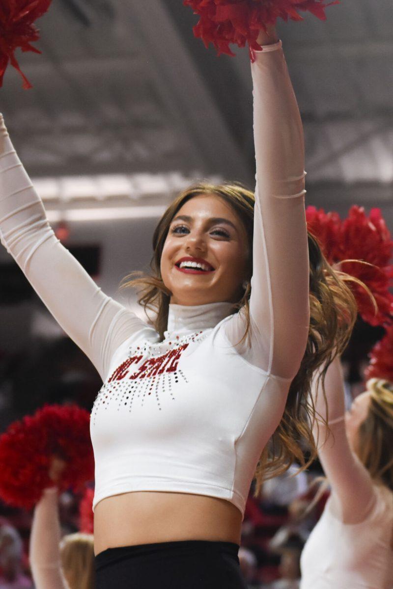 Freshman Molly Kraska performs with the NC State Dance Team during the women's basketball game against Virginia at Reynolds Coliseum on Thursday, Jan. 11, 2024.. The Wolfpack beat the Cavaliers 93-66.