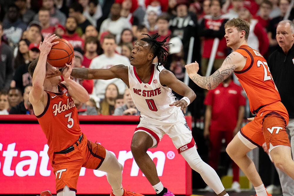 Graduate guard DJ Horne reaches for the ball during the game against Virginia Tech in PNC Arena on Saturday, Jan. 20, 2024. Horne had four turnovers, four steals and scored 16 points during the game. NC State lost to Virginia Tech 84-78.
