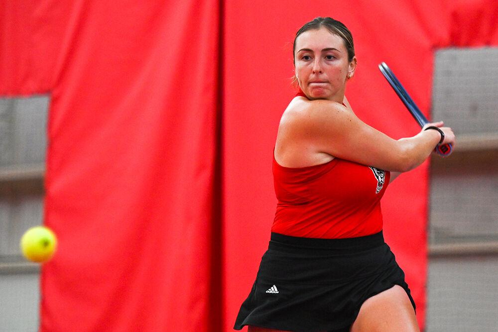Senior Abigail Rencheli backhands in her singles game against Campbell player Tamsin Hart on Saturday, Jan. 20, 2024 at the J.W. Isenhour Tennis Center. Rencheli won her singles match 2-0, with scores of 6-1 and 6-1 for the individual sets. NC State won the match 7-0.