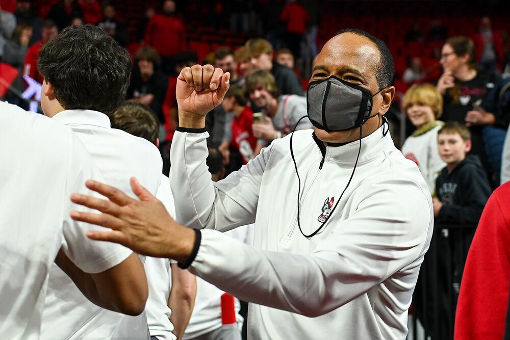Head coach Kevin Keatts congratulates his team for their win over the Wake Forest Demon Deacons in PNC Arena on Tuesday, Jan. 16, 2024. Keatts was ejected in the first half after arguing with the referees over a missed foul call. The Wolfpack beat the Demon Deacons 83-76.