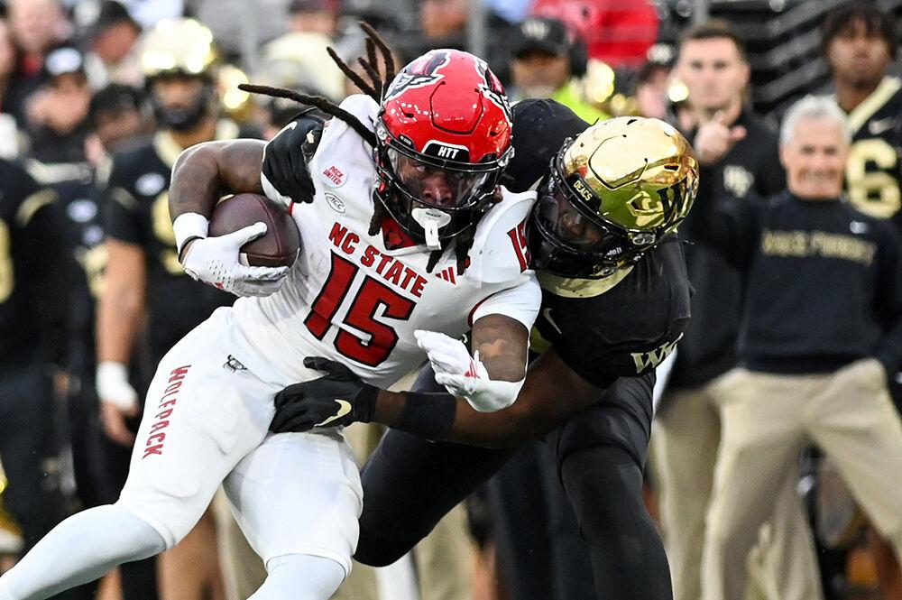 Senior wide receiver Keyon Lesane rushes the ball during the game against Wake Forest at Allegacy Federal Credit Union Stadium on Saturday, Nov. 11, 2023. Lesane completed 27 receiving yards. NC State beat Wake Forest 26-6.