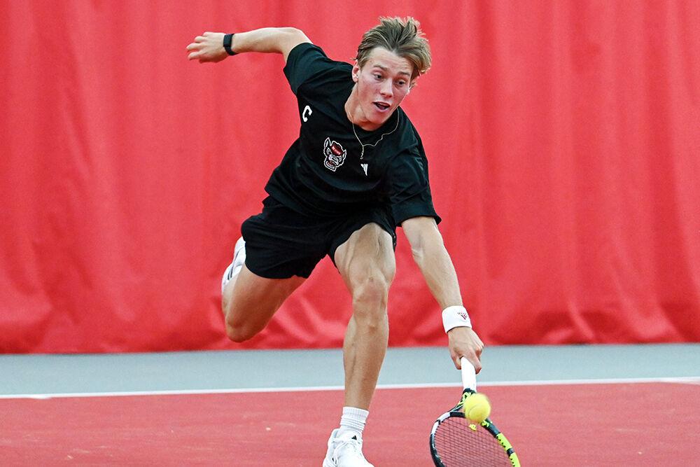 Junior Fons Van Sambeek sprints to return the ball during the match against Northwestern at J.W. Isenhour Tennis Center on Monday, Jan. 15, 2024. Van Sambeek won both his doubles and singles matches. NC State beat Northwestern 6-1.