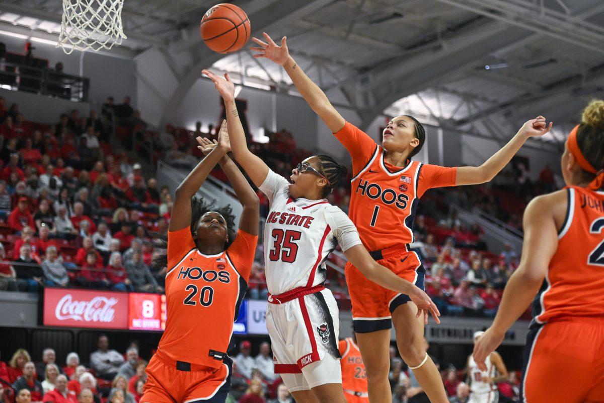Freshman guard Zoe Brooks jumps to shoot the ball during the game against Virginia in Reynolds Coliseum on Thursday, Jan. 11, 2024. Brooks scored 19 points for the Wolfpack.