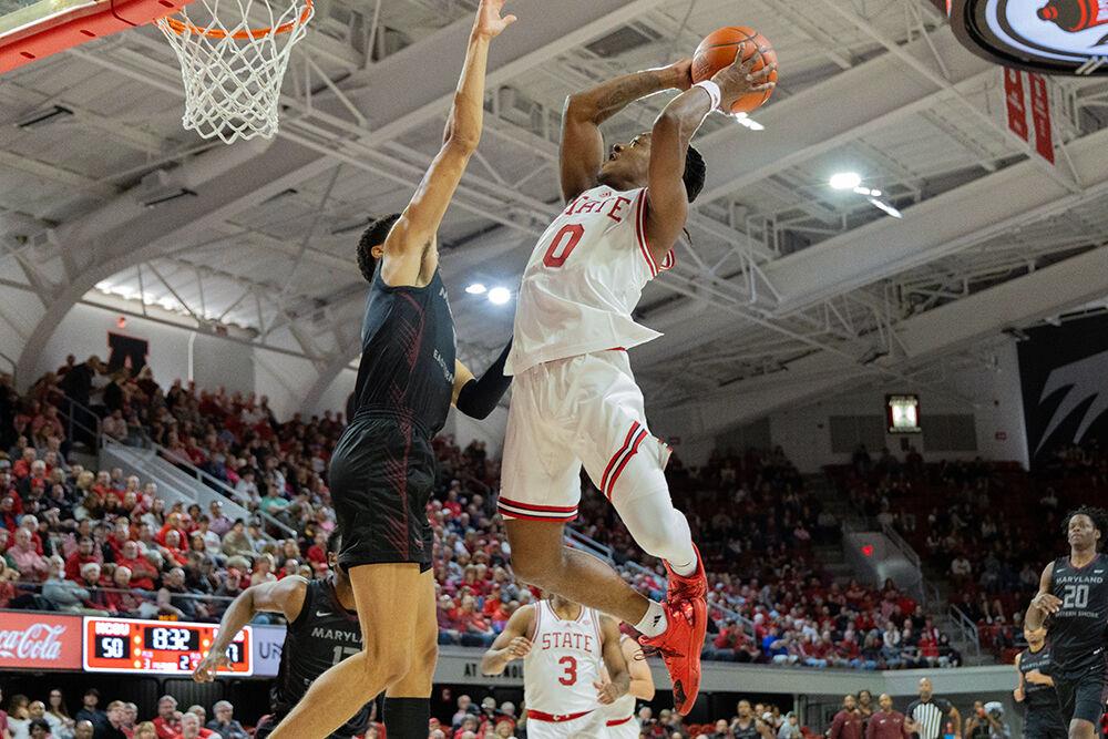 Graduate guard DJ Horne shoots during the game versus Maryland-Eastern Shore in Reynolds Coliseum on Wednesday, Dec. 6, 2023. Horne scored 10 points during the game. NC State beat&#160;UMES 93-61.