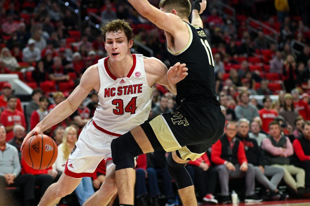 Junior forward Ben Middlebrooks battles to get to the basket during the game versus the Wake Forest Demon Deacons in PNC Arena on Tuesday, Jan. 16, 2024. Middlebrooks scored 14 points and had 6 rebounds against Wake Forest. The Wolfpack beat the Demon Deacons 83-76.