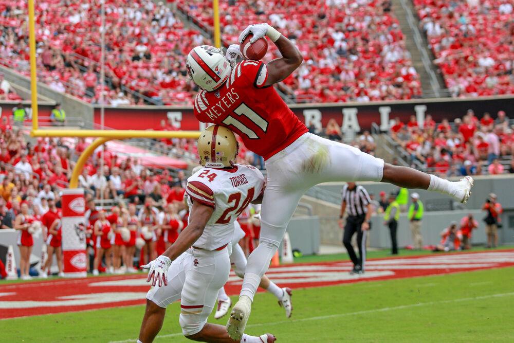 Redshirt junior wide receiver Jakobi Meyers goes up over a defender for the grab. Meyers had a team-high 10 receptions for 99 yards during the 28-23 win over Boston College on Saturday, Oct. 6, 2018 in Carter-Finley Stadium.