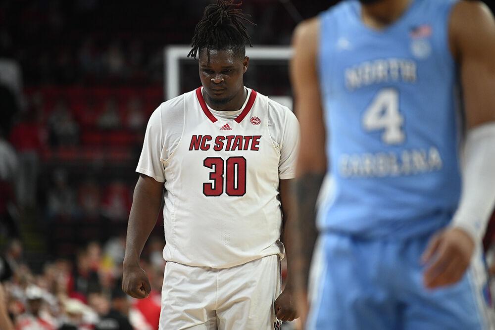 Graduate forward DJ Burns walks up the court after a Carolina score during the Wolfpack's home game against the UNC-Chapel Hill Tar Heels in PNC Arena on Wednesday, Jan. 10, 2024. The Tar Heels beat the Pack 67-54.