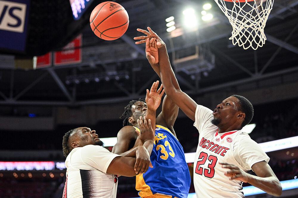 Graduate forward DJ Horne holds back his opponent while junior forward Mohamed Diarra attempts to rebound the ball during the game against&#160;Pittsburgh in PNC Arena on Wednesday, Feb. 7, 2024. NC State lost to Pitt 67-64.