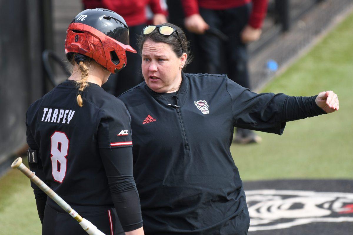 Head coach Lindsay Leftwich (right) gives instruction to redshirt sophomore infielder Michele Tarpey (left) in the game against Elon at Dail Softball Stadium on Saturday, Feb. 17, 2024. NC State won the game 5-2.
