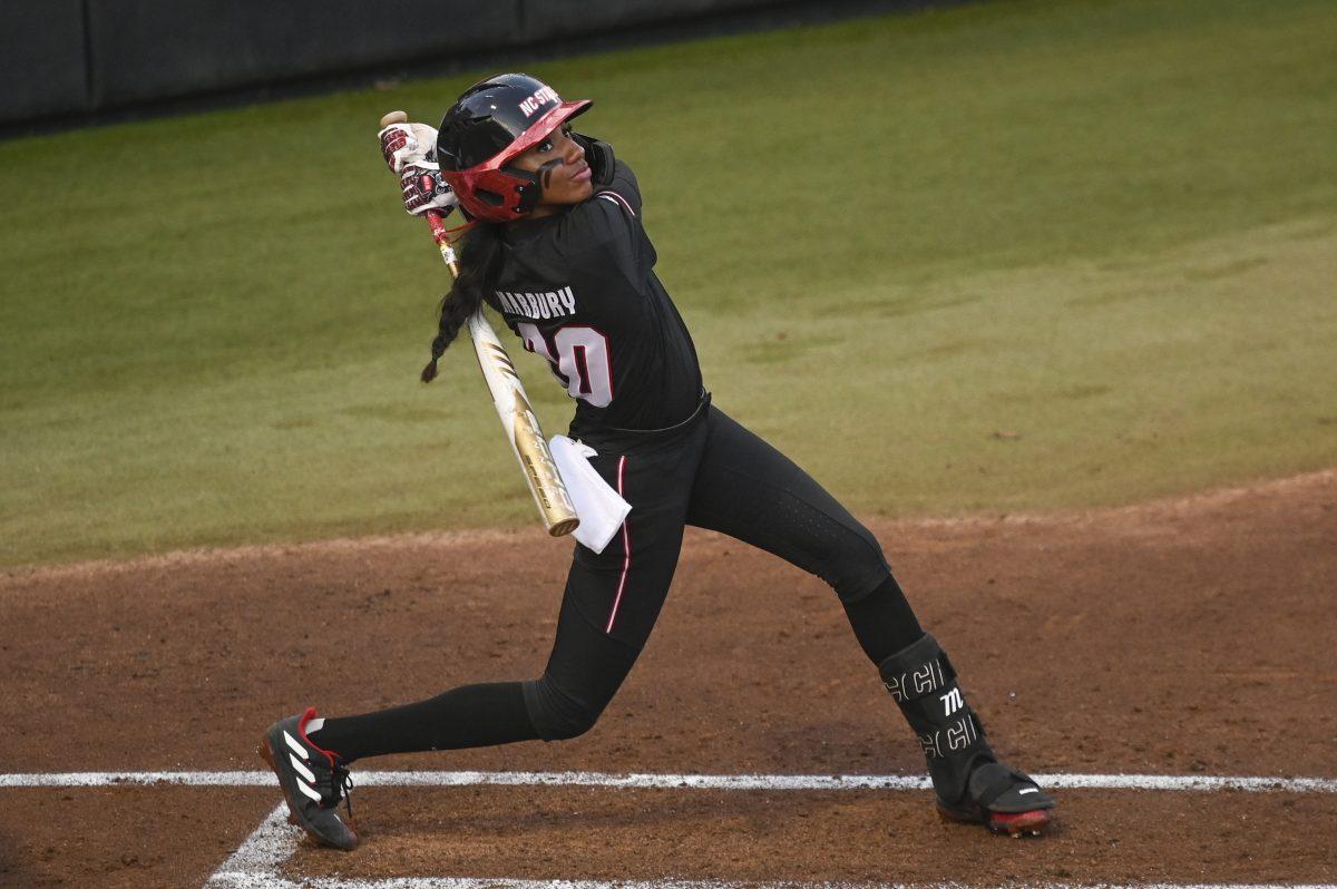 Sophomore utility MaKayla Marbury follows through on her swing during the game against Albany in Dail Softball Stadium on Friday, Feb. 23, 2024. Marbury had two home runs. The Wolfpack defeated the Great Danes 9-0 (5).