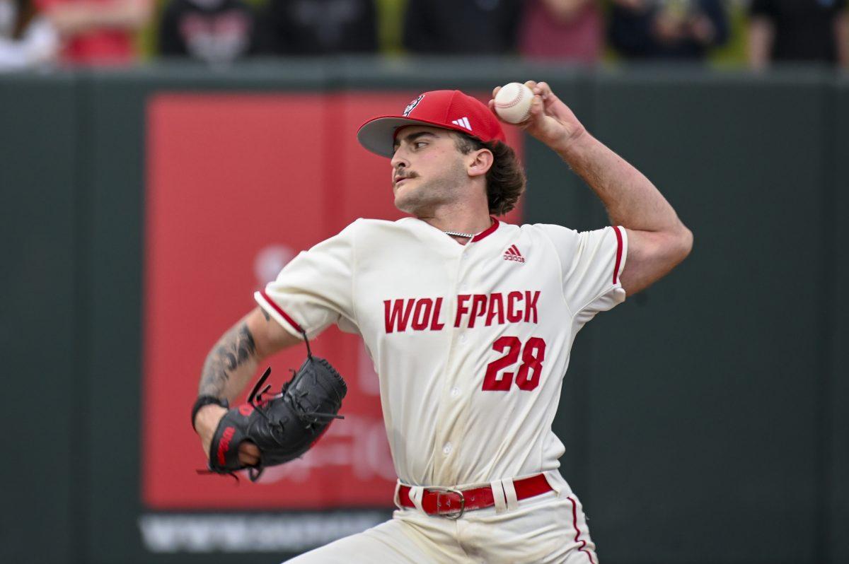 Freshman pitcher Cooper Consiglio throws the ball during the baseball game against Queens University at Doak Field at Dail Park on Wednesday, Feb. 28, 2024. Consiglio played in 4.0 innings and made three strike outs. NC State beat Queens 17-2.