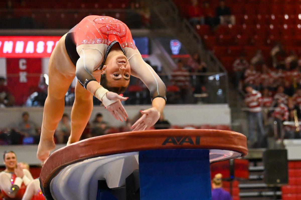 Junior Lucy Lehman flips on the vault during the meet against Clemson in Reynolds Coliseum on Saturday, Feb. 17, 2024. Lehman ran exhibition on the vault. NC State beat Clemson 197.575-196.000.