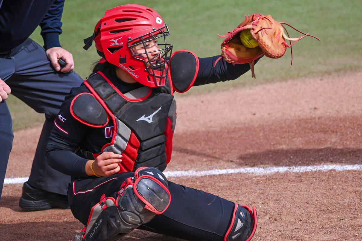 Sophomore catcher Amanda Hasler catches the ball during the game against Elon at Dail Softball Stadium on Saturday, Feb. 17, 2024. The Wolfpack defeated the Phoenix 5-2.