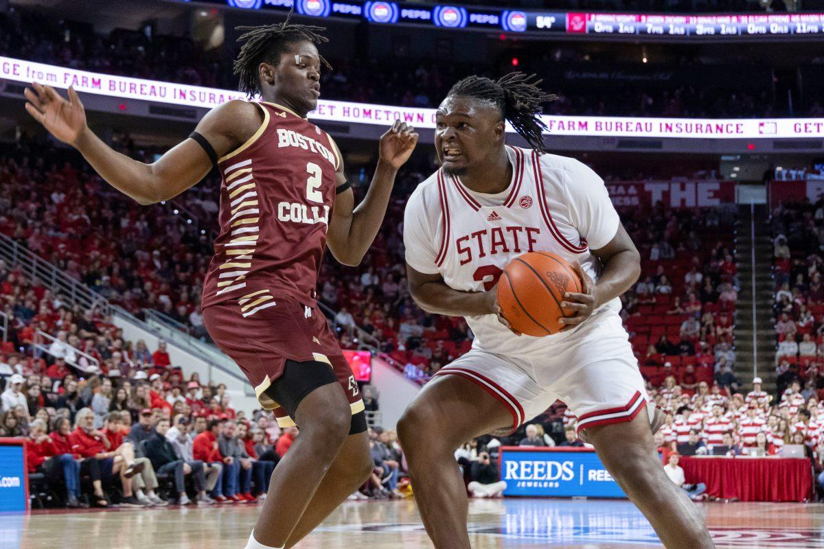 Graduate forward DJ Burns Jr. pushes past his opponent during the game against Boston College in PNC Arena on Saturday, Feb. 24, 2024. Burns scored 19 points during the game. NC State beat Boston College 81-70.
