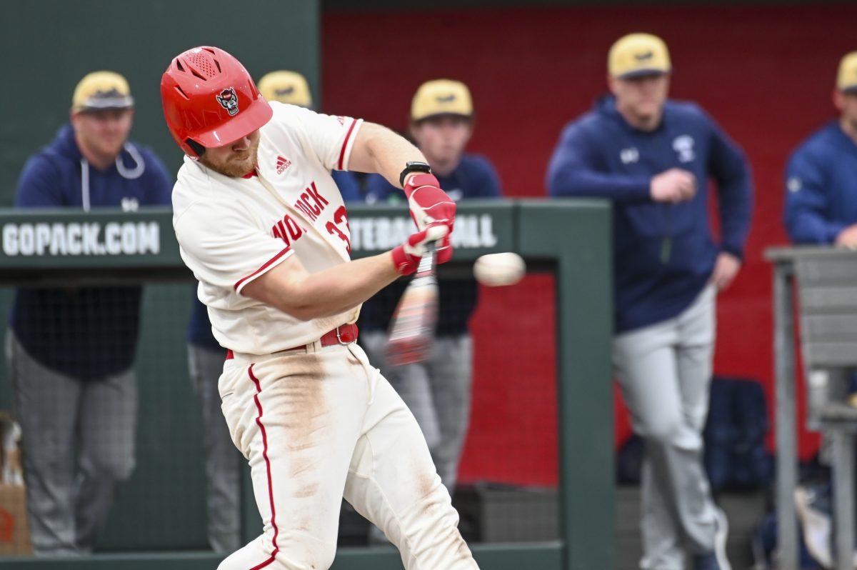Graduate infielder Garrett Pennington swings his bat during the baseball game against Queens University at Doak Field at Dail Park on Wednesday, Feb. 28, 2024. Pennington scored one run. NC State beat Queens 17-2.