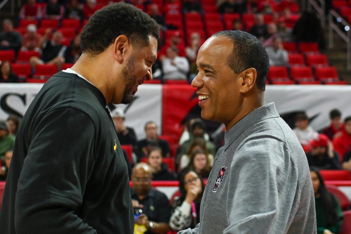 NC State head coach Kevin Keatts greets Pittsburgh head coach Jeff Capel before the game in PNC Arena on Wednesday, Feb. 7, 2024. The Pittsburgh Panthers beat the NC State Wolfpack 67-64.