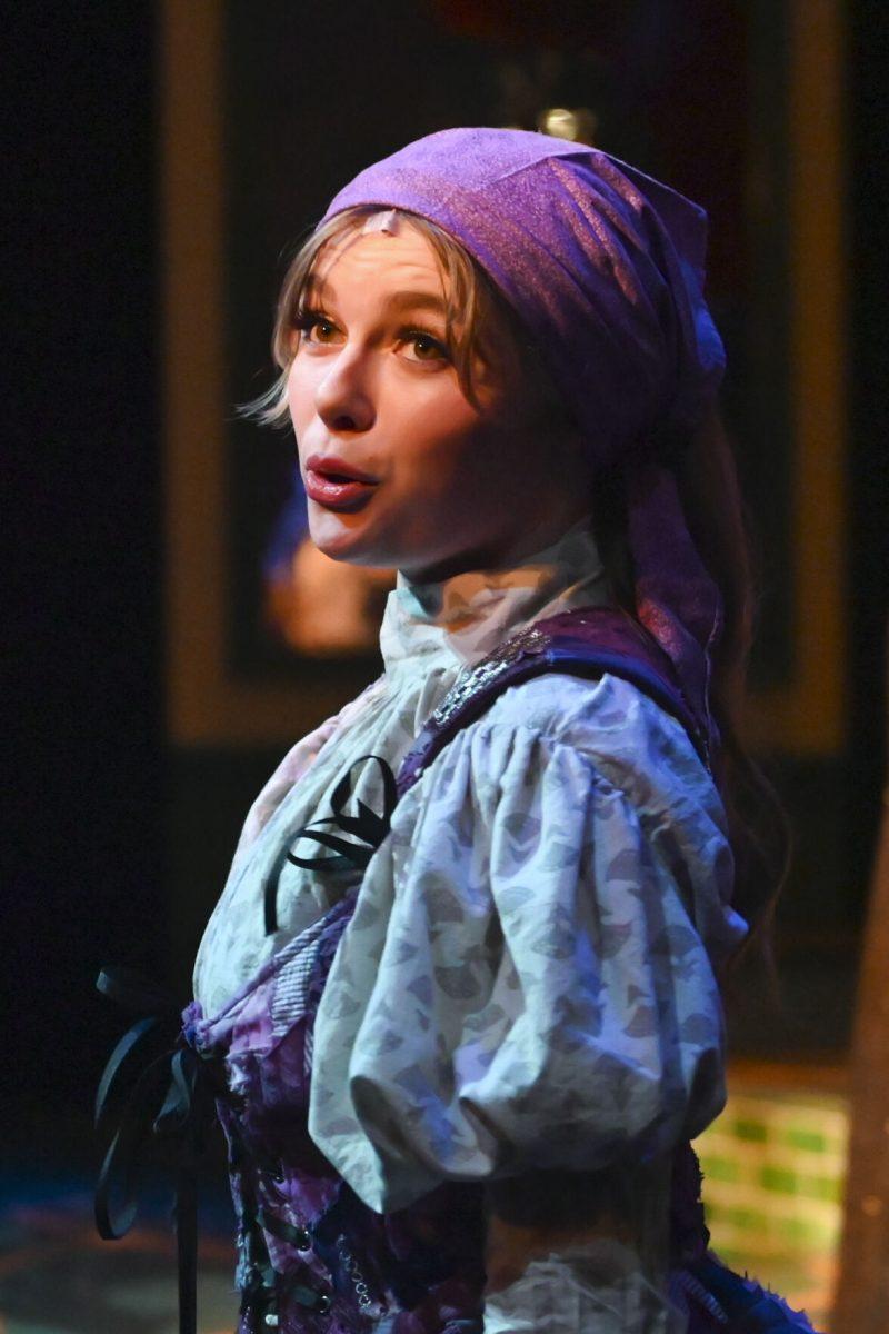 Emma Fornes, a second-year studying business and in film studies and music studies, sings with the ensemble during the performance of Jekyll and Hyde in Stewart Theatre on Wednesday, Feb. 14, 2024. The musical was based on author Robert Louis Stevenson's novel, The Strange Case of Dr. Jekyll and Mr. Hyde.