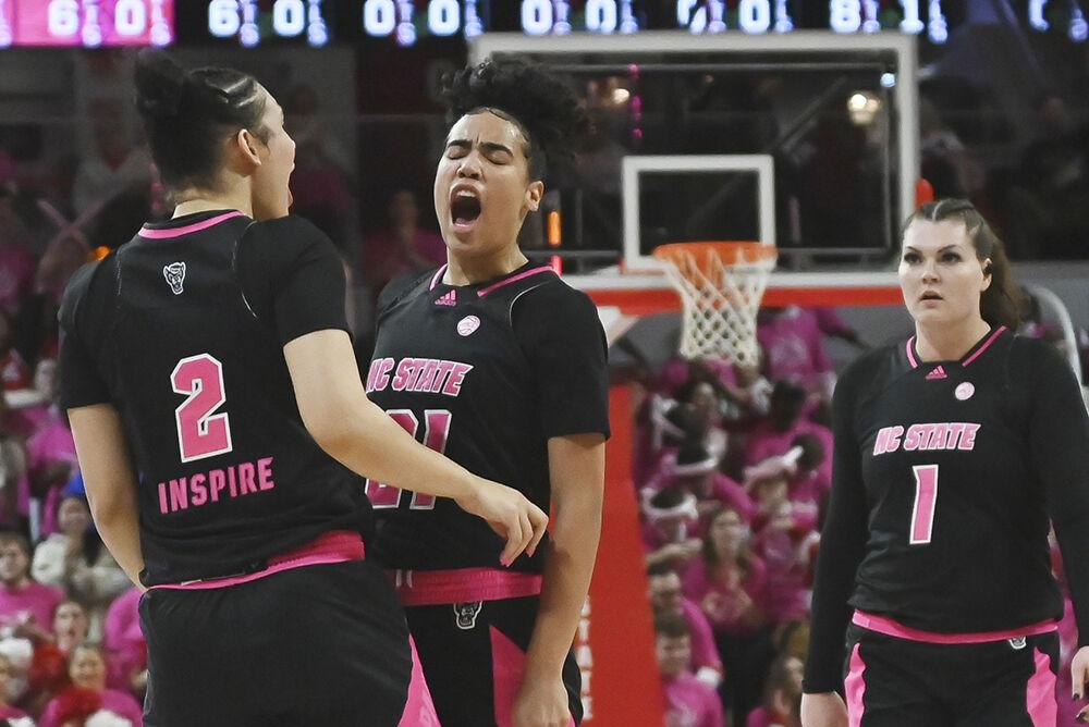 Senior guard Madison Hayes celebrates during the Wolfpack's home game against the Louisville Cardinals in Reynolds Coliseum on Monday, Feb. 5, 2024. The game was the team's annual 'Play 4 Kay' game honoring the legacy of the late Kay Yow and supporting breast cancer survivors. Hayes recorded 12 points and 10 rebounds. The Wolfpack defeated the Cardinals 77-67.