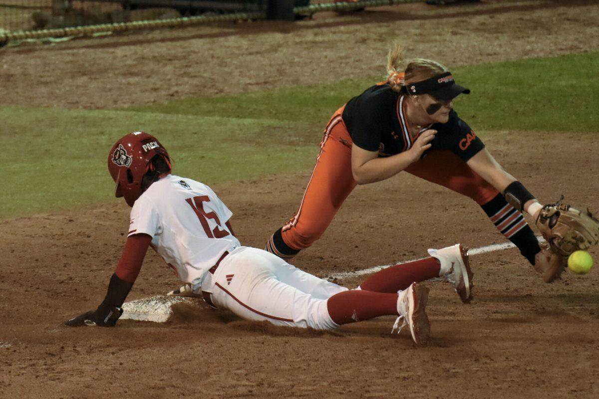 Senior second baseman Kaylee Lambrecht slides safely into third base during the game against Campbell at Dail Softball Stadium on Friday, Feb. 16, 2024. Lambrecht had two at bats, one run, and one hit. NC State beat Campbell 4-3.