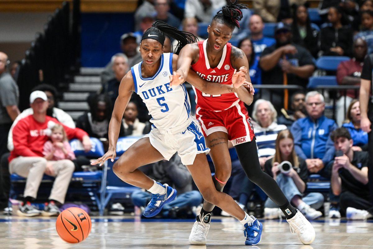 Junior guard Saniya Rivers gets tangled up with her opponent while knocking the ball away during the game against Duke at Cameron Indoor Stadium on Sunday, Feb. 25, 2024. Rivers scored 13 points and made eight rebounds. NC State fell 68-58 to Duke.