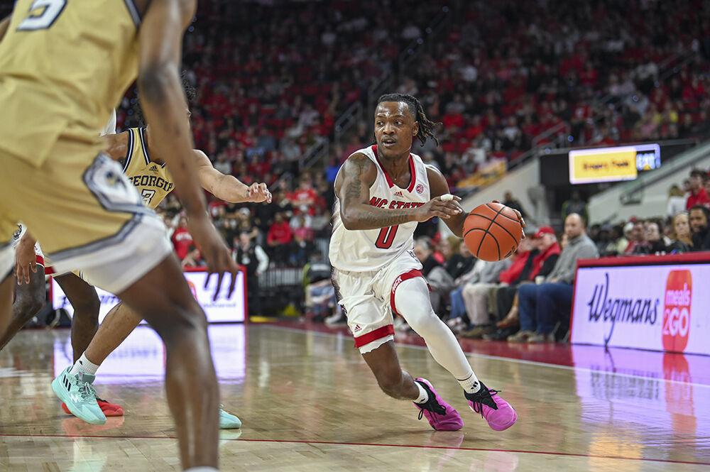 Graduate guard DJ Horne dribbles the ball during the basketball game against Georgia Tech in PNC Arena on Saturday, Feb. 3, 2024. NC State beat Georgia Tech 82-76.