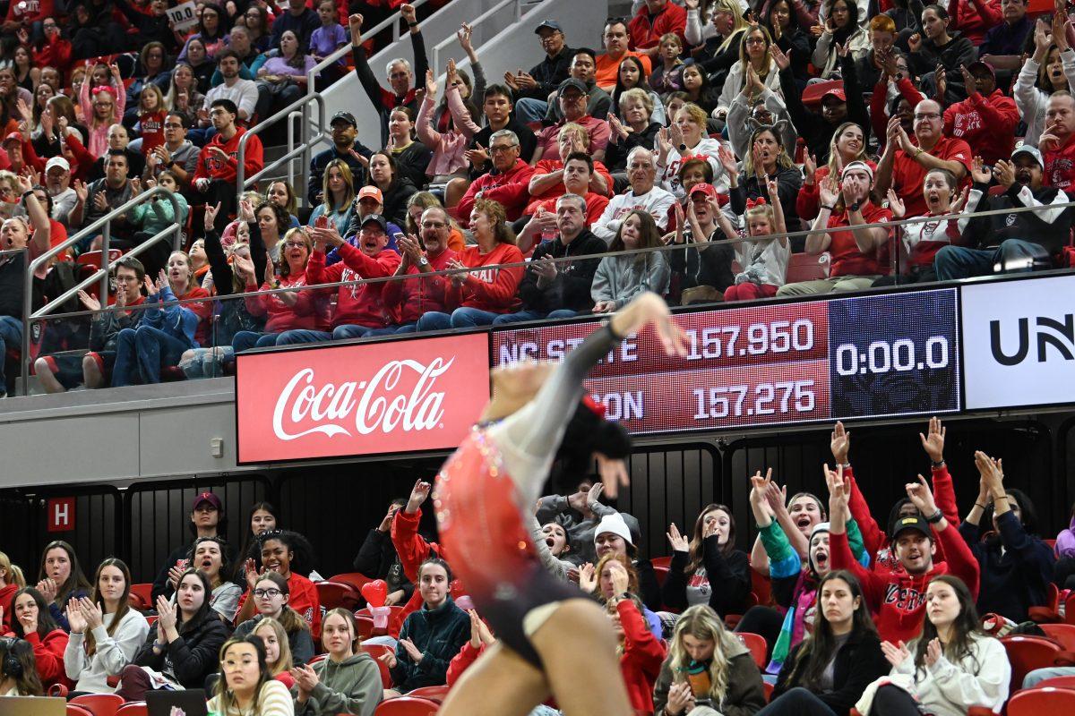 The crowd cheers after freshman Ashley Knight landed a pass in her floor routine during the meet against Clemson in Reynolds Coliseum on Saturday, Feb. 17, 2024. Knight scored a 9.900 on the floor and a 9.875 on the vault. NC State beat Clemson 197.575-196.000 to be crowned ACC Regular Season Champions.