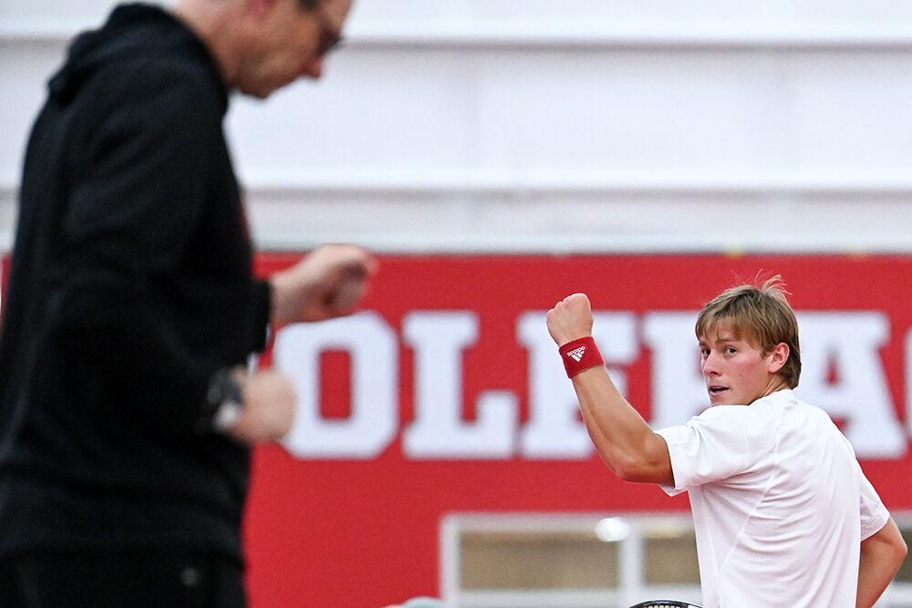 Head coach Kyle Spencer and junior Fons Van Sambeek pump their fists after Van Sambeek scored a point during the match against Princeton at J.W. Isenhour Tennis Center on Friday, Jan. 19, 2024. Van Sambeek won his singles match 6-2, 6-1. NC State beat Princeton 7-0.