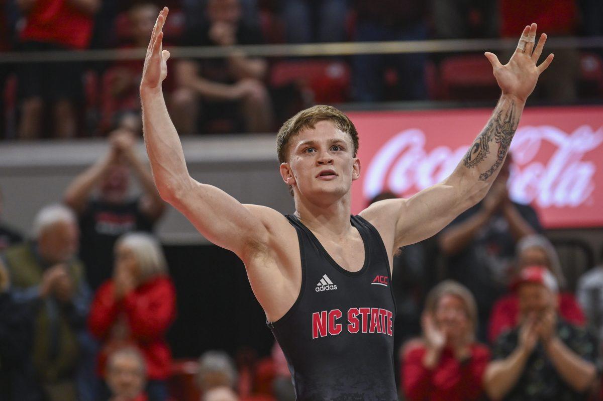 Redshirt junior Kai Orine celebrates a win during the wrestling match against the University of Virginia in Reynolds Coliseum on Friday, Feb. 9, 2024. Orine won the 133 bout 29-3. NC State beat UVA 38-3