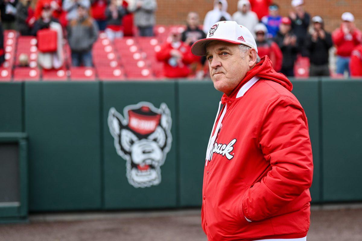 Head coach Elliott Avent walks off the field following his 1,000th win at NC State after the game against VCU at Doak Field at Dail Park on Sunday, Feb. 18, 2024. NC State beat VCU 5-3 and won the series.