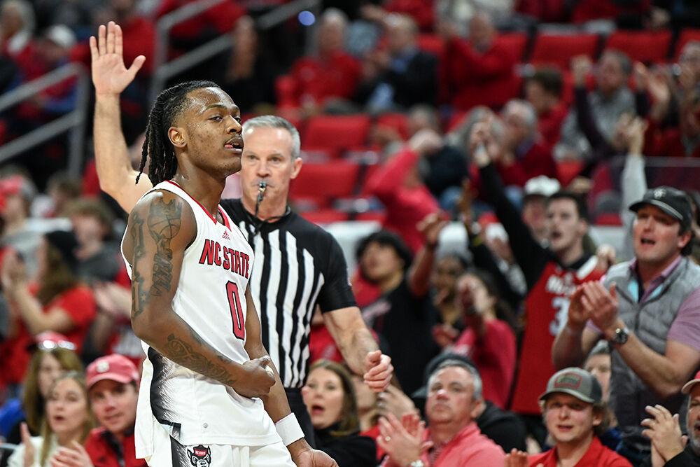 Graduate guard DJ Horne hits the "blood in my veins" pose after scoring a three-pointer during the game against&#160;Pittsburgh in PNC Arena on Wednesday, Feb. 7, 2024. Horne led in scoring with 25 points. NC State lost to Pitt 67-64.