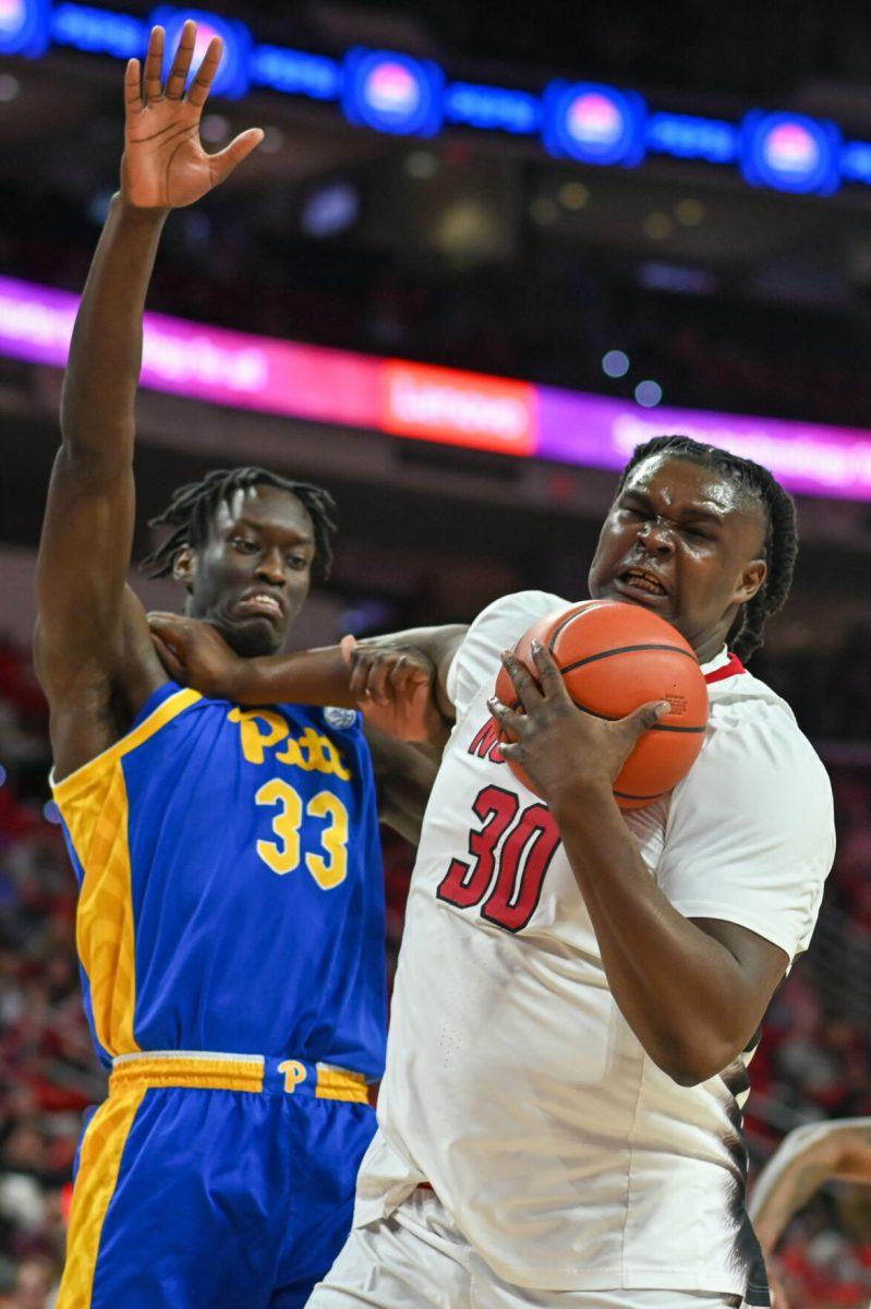Graduate forward DJ Burns fights to keep possession of the ball during the game versus the Pittsburgh Panthers in PNC Arena on Wednesday, Feb. 7, 2024. Burns scored 19 points against Pittsburgh. The Panthers beat the Wolfpack 67-64.