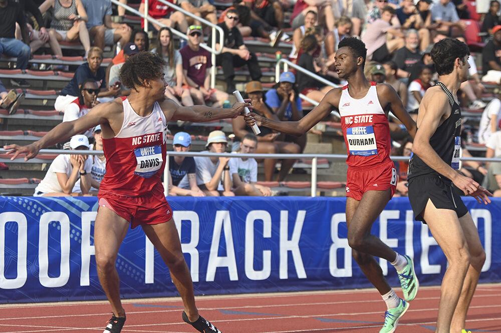 Graduate jumper Jamar Davis grabs the baton from senior mid-distance runner Kyle Durham during the 4x400m rleay event of the outdoor track ACC championships at the Paul Derr Track and Field Facility on Saturday, May 13, 2023. The men's 4x400 relay team finished with a time of 3:15.73.