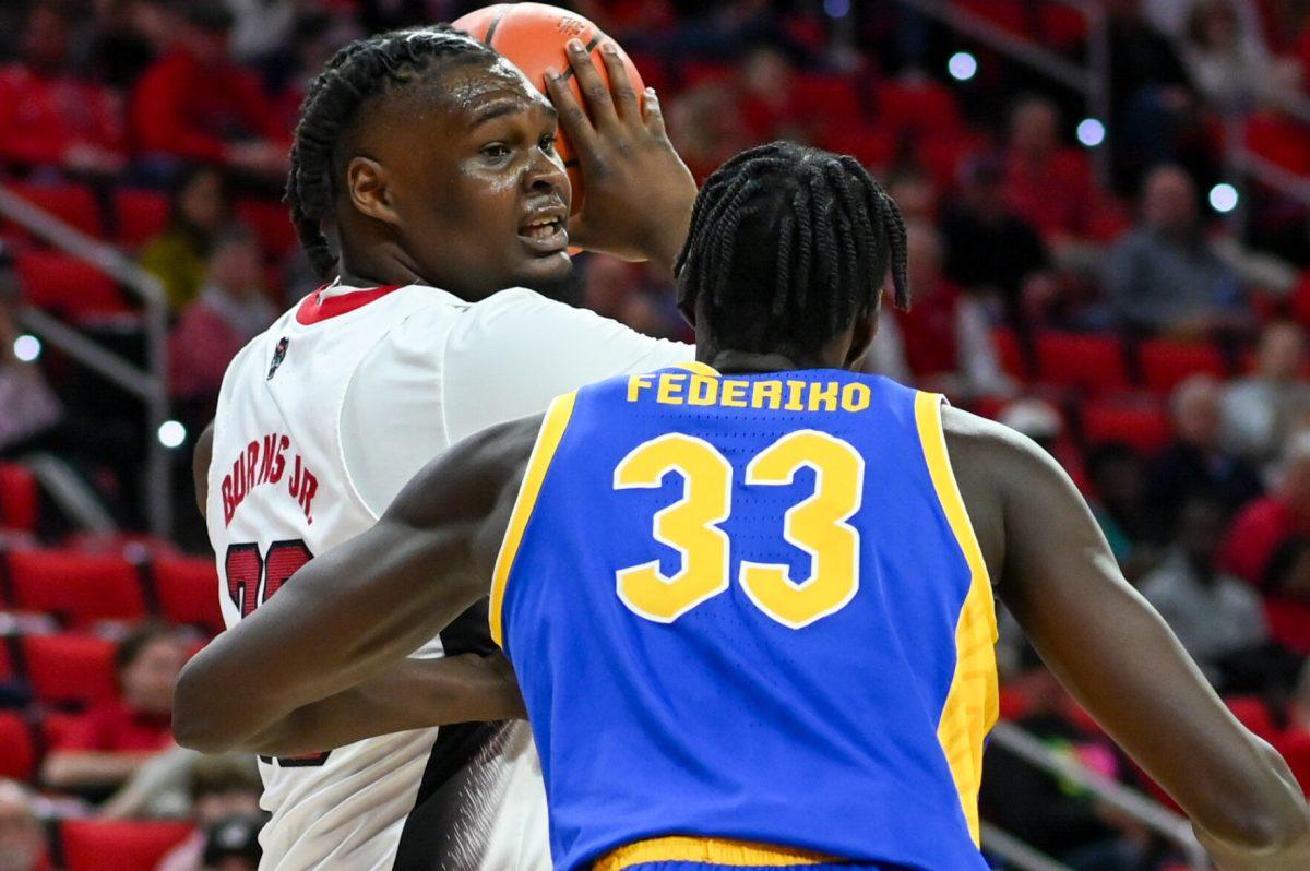 Graduate forward DJ Burns looks for an open pass during the game versus the Pittsburgh Panthers in PNC Arena on Wednesday, Feb. 7, 2024. Burns scored 19 points against Pittsburgh. The Panthers beat the Wolfpack 67-64.