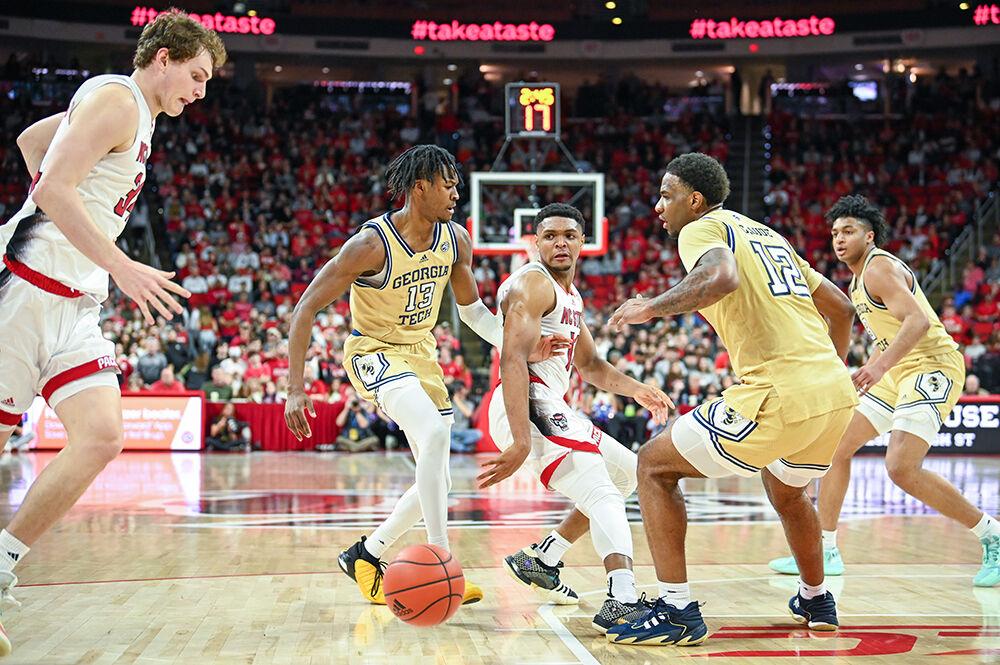Graduate guard Casey Morsell passes the ball to Junior forward Ben Middlebrooks during the game against Georgia Tech in PNC Arena on Saturday, Feb. 3, 2024. Morsell finished with three assists. The Wolfpack defeated the Yellow Jackets 82-76.