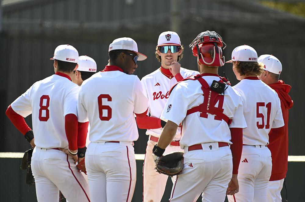 Members of the NC State baseball team take a time out to discuss during the game against the University of Virginia at Doak Field at Dail Park on Saturday, March 18, 2023. The Wolfpack beat the Cavaliers 5-4.