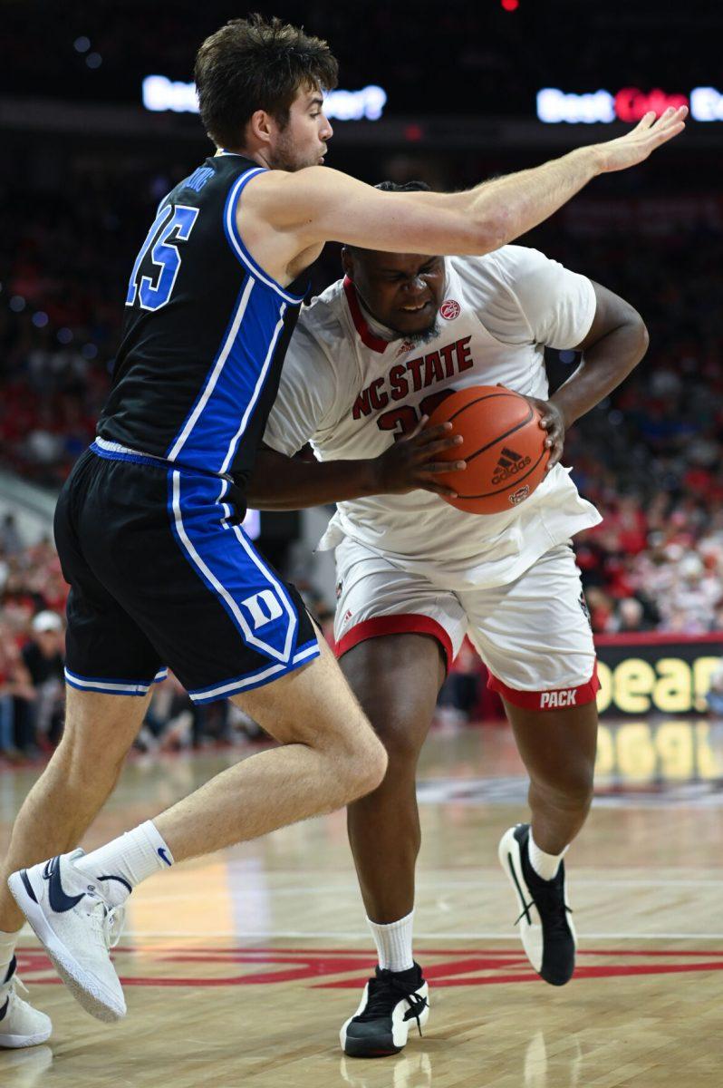 Graduate forward DJ Burns pushes to the basket in the game versus the Duke Blue Devils in PNC Arena on Monday, March 4, 2024. Burns led the Wolfpack with 27 points against Duke. The Wolfpack lost to the Blue Devils 79-64.