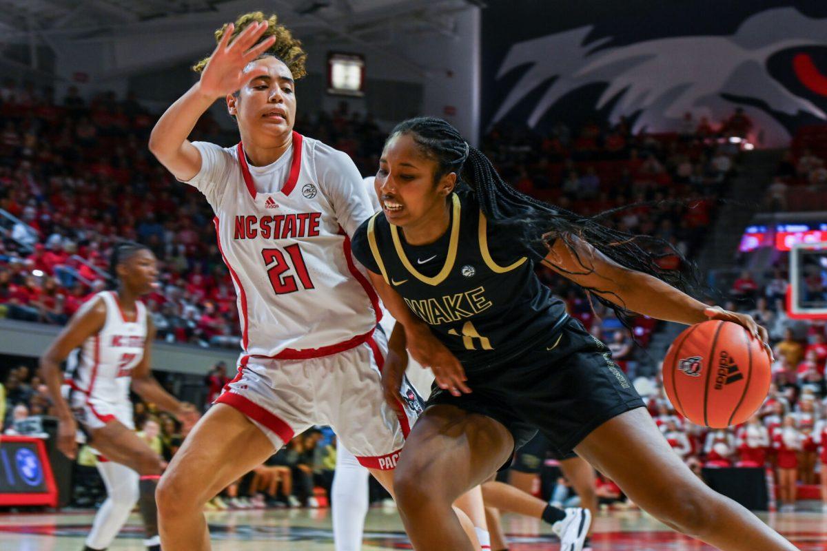 Senior guard Madison Hayes defends her opponent during the game against Wake Forest in Reynolds Coliseum on Sunday, March 3, 2024. NC State beat Wake Forest 75-57.
