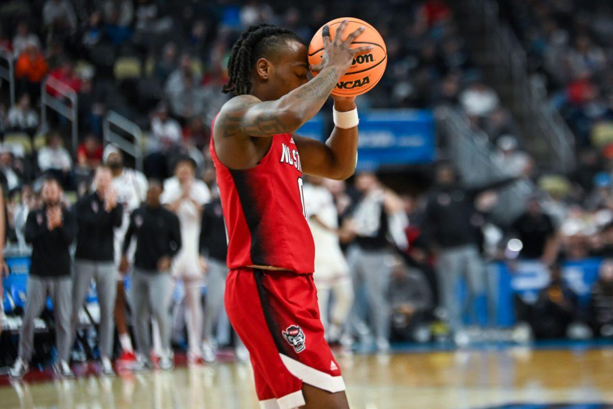 Graduate Guard DJ Horne gets frustrated about a penalty during the NCAA March Madness first round game against the Texas Tech Red Raiders in PPG Paints Arena on Thursday, March 21, 2024. Horne had one steal during the game. NC State beat Texas Tech 80-67.