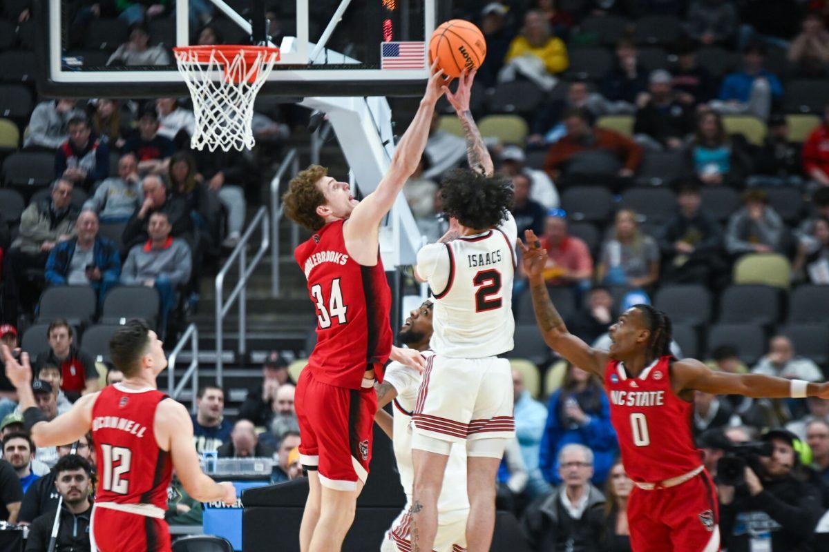 Junior forward Ben Middlebrooks blocks a shot during the NCAA March Madness first round game against the Texas Tech Red Raiders in PPG Paints Arena on Thursday, March 21, 2024. Middlebrooks had 21 points. NC State beat Texas Tech 80-67.